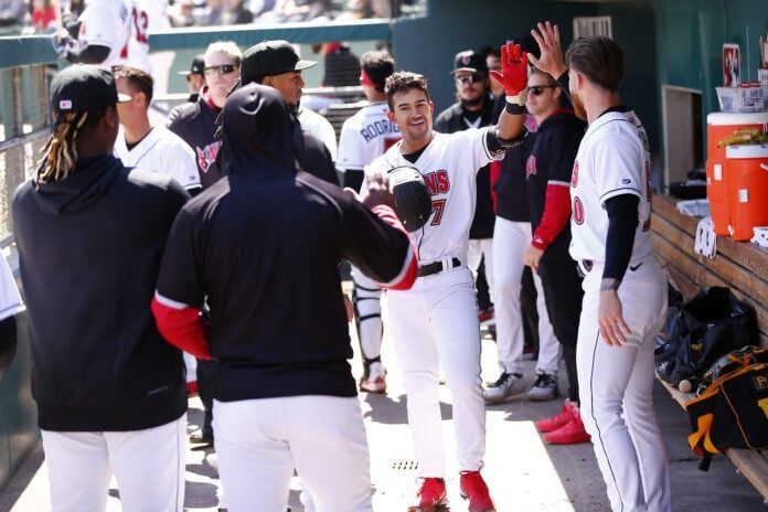 Indianapolis Indians season opener INDIANAPOLIS, IN - APRIL 02: Indianapolis Indians infielder Nick Gonzales (7) gets high fives after hitting his home run during a MiLB game between the Omaha Storm Chasers and the Indianapolis Indians on April 02, 2023 at Victory Field in Indianapolis, IN.(Photo by Jeff Brown/Indianapolis Recorder)