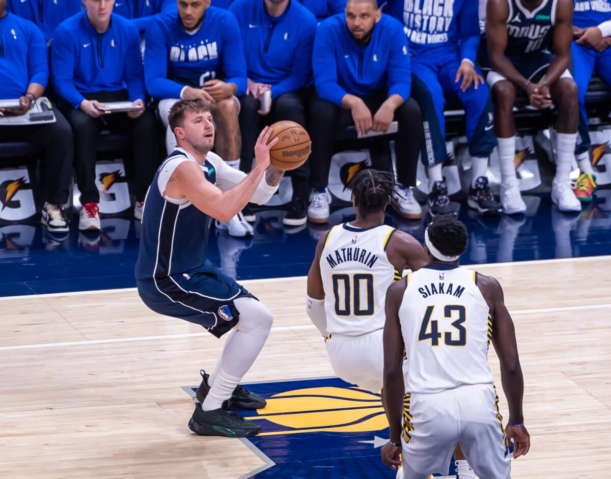 Dallas Mavericks forward Luka Doncic (77) attempts a long shot over Pacers guard Bennedict Mathurin (00) and forward Pascal Siakam (43)  during their matchup at Gainbridge Fieldhouse, located in Downtown Indianapolis, IN., on February 25, 2024. (Photo/Walt Thomas) 