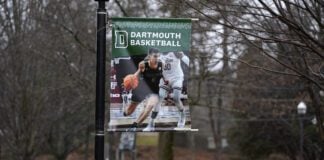 A poster of a basketball player is attached to a lamppost on the campus of Dartmouth College, Tuesday, March 5, 2024, in Hanover, N.H. Dartmouth basketball players voted to form a union, an unprecedented step in the continued deterioration of the NCAA's amateur business model. (AP Photo/Robert F. Bukaty)