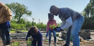 Volunteers in the Stephen Talley Memorial Garden where fresh fruits and vegetables are harvested at Light of the World Christian Church. (Photo provided/Light of the World Christian Church)