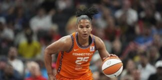 Alyssa Thomas dripping a WNBA ball