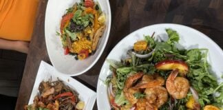 a variety of salad and bowls on display