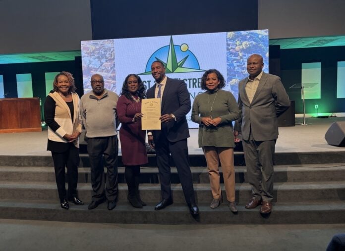 38TH RENAISSANCE Alongside city leaders, Pastor Kenneth Sullivan Jr. of New Direction Church announced the 38th Street Renaissance Campaign in partnership with the National Bank of Indianapolis during a press conference on Dec. 11. (Photo/Chloe McGowan)
