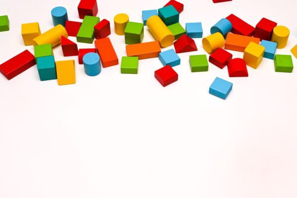 colorful wooden bricks on the white background. copy space