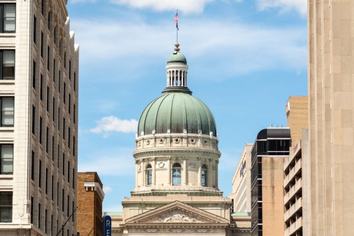 The Indiana Statehouse capitol building with blue sky behind. Indiana, USA.