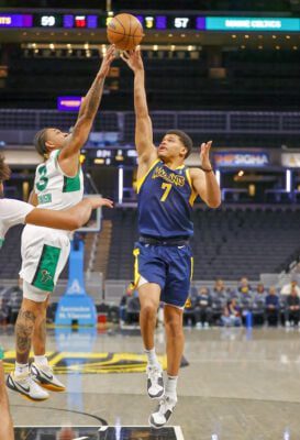 Indiana Mad Ants basketball player RayJ Dennis attempting a floating jumpshot during an NBA G League basketball game against the Maine Celtics.