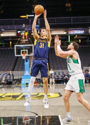 Indiana Mad Ants basketballer Dakota Mathias during an NBA G League basketball game against the Maine Celtics shooting a jumpshot.