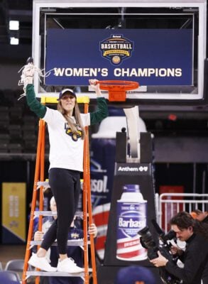 Green Bay head coach Kayla Karius doing the honors after winning the 2025 Barbasol Horizon League Women's Basketball Tournament, on March 11, 2025 at the Corteva Coliseum in Indianapolis, Indiana. (Photo/David Dixon)
