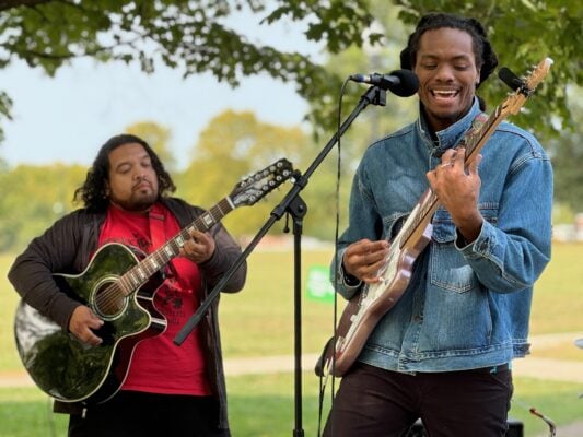 Khiry Managan (right) and Angel “Ocho” Ochoa (left) of the Indianapolis-based band Forgotten Tribe perform at the September 2024 Levitt VIBE Music Series concert.