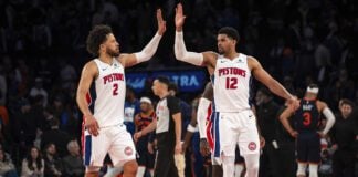 Detroit Pistons guard Cade Cunningham (2) and forward Tobias Harris (12) high-five at the end of Game 2 of an NBA basketball first-round playoff series against the New York Knicks, Monday, April 21, 2025, in New York. (AP Photo/Angelina Katsanis)
