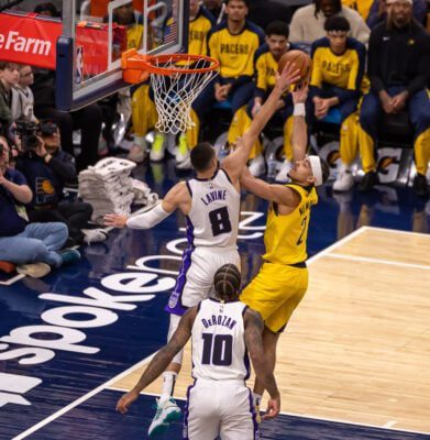 Sacramento Kings shooting guard Zach Lavine attempts to contest Indiana Pacers guard Andrew Nembhard (2) during the NBA game on March 31, 2025 at Gainbridge Fieldhouse, in downtown Indianapolis, Indiana. (Photo/Walt Thomas)