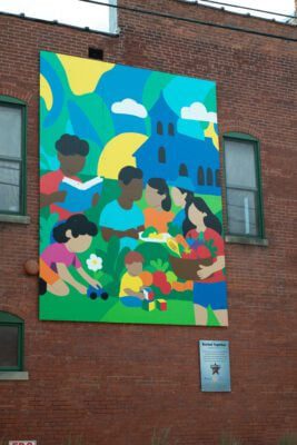 Boxx The Artist was selected to create the mural for FPCC, entitled “Rooted Together,” a celebration of community compassion and the renewing spirit of the Fletcher Place Community Center through the Legacy Project. (Photo/Mia Moore)