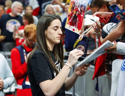 Indiana Fever guard Caitlin Clark (22) was sidelined with a left groin injury for the July 5, 2025 WNBA game against the Los Angeles Sparks in downtown Indianapolis, Indiana. (Photo/David Dixon)