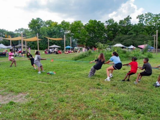 Youth play a game of tug-of-war at 'A Family Affair' community concert and picnic. (Photo/Mathis Media)