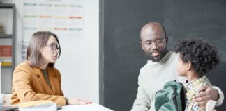 Teacher having conversation with parent
