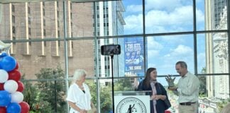 Marion County Clerk Kate Sweeney Bell recognized Adam Wilson and Margo Kelly with the Beacon of Freedom Award during the 60th Anniversary of the Voting Rights Act celebration on Aug. 6 at the Indianapolis Arts garden. (Photo/Chloe McGowan)