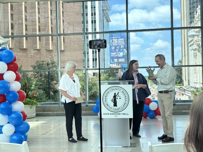 IMG_3337 Marion County Clerk Kate Sweeney Bell recognized Adam Wilson and Margo Kelly with the Beacon of Freedom Award during the 60th Anniversary of the Voting Rights Act celebration on Aug. 6 at the Indianapolis Arts garden. (Photo/Chloe McGowan)