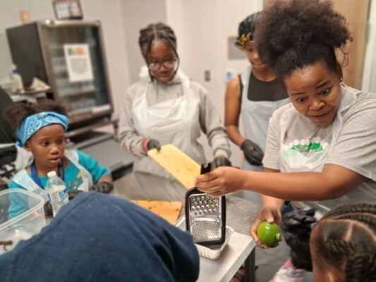 2025 Cooking Workshop and Lead Prevention community event held at Douglass Park to teach community members how to combat lead absorb ion with certain meals.