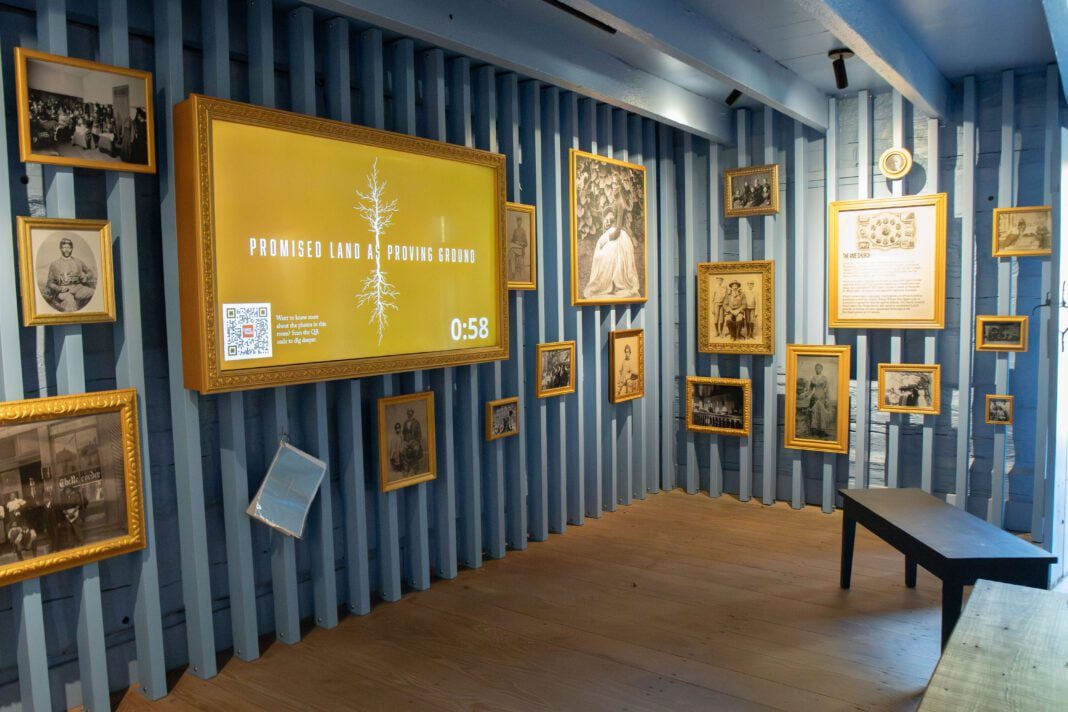 Photos from the Indiana Historical Society and Library of Congress adorn the walls of the Resistance Cabin, painted a haint blue to honor the spiritual connection African American Hoosiers had.
