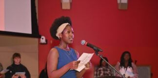 Celine Umutesi performs her poem "Fear Equals Success" during the Fall Fest Slammin' Rhymes Challenge at Central Library on Nov. 16, 2024. Local students grades 6-12 are invited to enter the 2025 Slammin' Rhymes Challenge by October 30. (Photo/The Indianapolis Public Library)