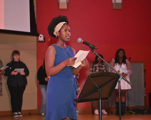 Celine Umutesi performs her poem "Fear Equals Success" during the Fall Fest Slammin' Rhymes Challenge at Central Library on Nov. 16, 2024. Local students grades 6-12 are invited to enter the 2025 Slammin' Rhymes Challenge by October 30. (Photo/The Indianapolis Public Library)