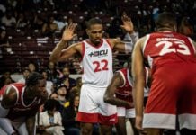 College basketball player during the HBCU All-Star Game with hands up in April of 2023 in Houston, Texas.