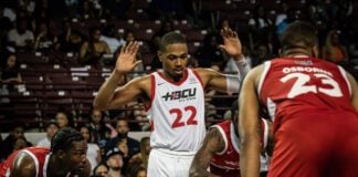College basketball player during the HBCU All-Star Game with hands up in April of 2023 in Houston, Texas.