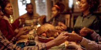 Community Arts Calendar: Thanksgiving and other November happenings Close of kids saying grace while having Thanksgiving dinner with their family at dining table. (Photo/Getty Images)
