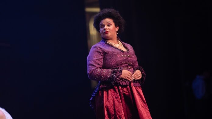 Indianapolis Recorder Arts & Culture Reporter Chloe McGowan starring in the Disney musical "Newsies" as Medda Larkin in November of 2025 in Indianapolis, Indiana.