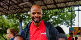 HBCU All-Star Game Travis Williams and members of the community holding pro-level basketballs in Houston, Texas.