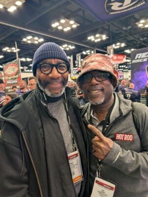 From left: Drag racing pioneer and Senior Sports Photographer Walt Thomas and Senior Editor at HOTROD Kaje "KJ" Jones" during the PRI Show on Dec. 12, 2025, at the Indiana Convention Center. (Photo/Noral Parham)