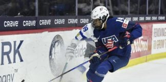 United States forward Laila Edwards (14) skates with the puck during the first period in the semifinals against Finland at the IIHF Women's World Hockey Championships in Utica, N.Y., Saturday, April 13, 2024. (Photo/Adrian Kraus, AP)