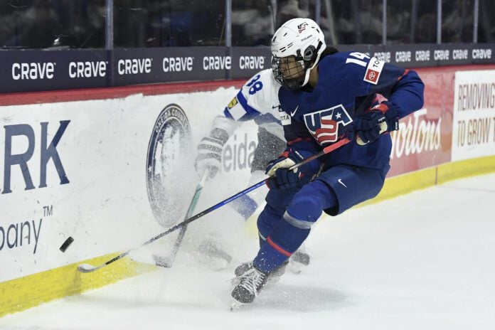 United States forward Laila Edwards (14) skates with the puck during the first period in the semifinals against Finland at the IIHF Women's World Hockey Championships in Utica, N.Y., Saturday, April 13, 2024. (Photo/Adrian Kraus, AP)