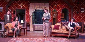 Detective Sergeant Trotter (Scot Greenwell), center, questions the suspects at Monkswell Manor in Beef & Boards Dinner Theatre’s production of Agatha Christie’s “The Mousetrap.”