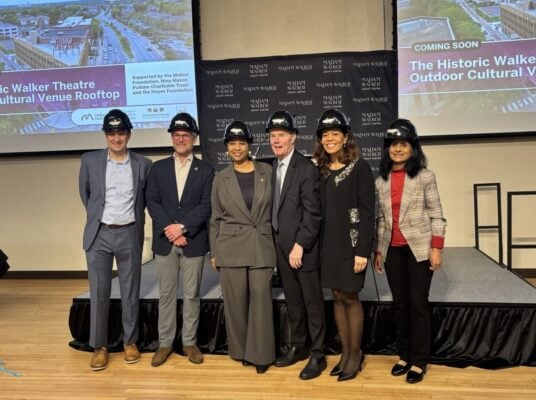 L to R: Nina Mason Pulliam Charitable Trust President & CEO Gene D'Adamo, Executive VP of Visit Indy Chris Gahl, MWLC President and CEO Kristian Stricklen, Mayor Joe Hogsett, MWLC Board Chair Nicole Wilson, and IU Indianapolis Chancellor & Executive VP Latha Ramchand broke "sky" on the Madam Walker Legacy Center's rooftop venue on Feb. 4, 2026. (Photo/Chloe McGowan)