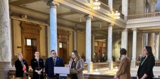 Representatives from a bipartisan coalition of more than 25 organizations, including Indiana Community Action Poverty Institute (ICAPI), gathered on Feb. 11 at the Indiana Statehouse in support of legislation to protect Hoosiers from harmful impacts of medical debt. (Photo/Chloe McGowan)